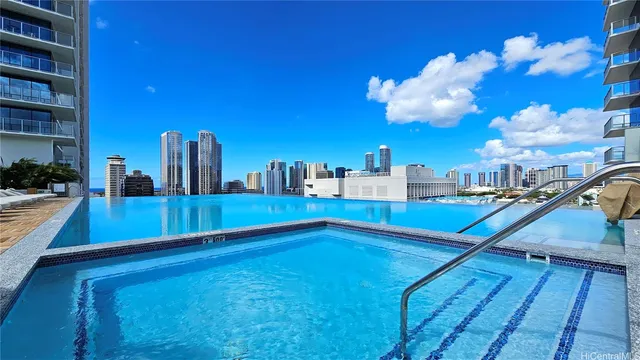 a view of a swimming pool with a lounge chairs