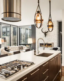 a kitchen with a stove and a white cabinets