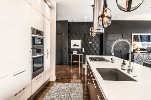 a kitchen with a sink and cabinets
