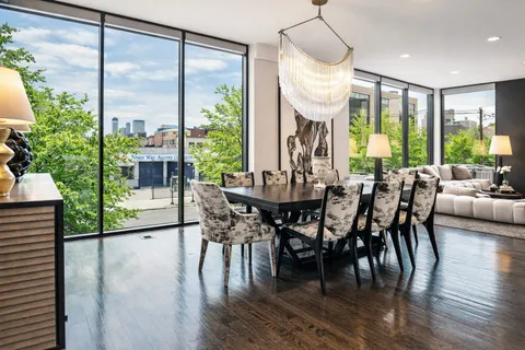 a view of a dining room with furniture window and outside view