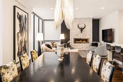 a living room with fireplace furniture and a flat screen tv