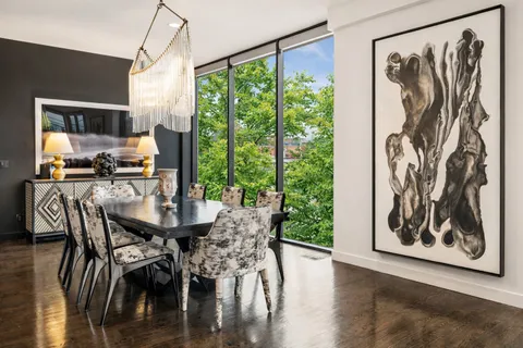 a view of a dining room with furniture window and outside view