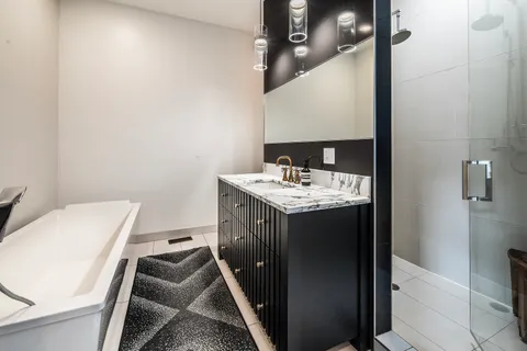 a bathroom with a sink a toilet and mirror