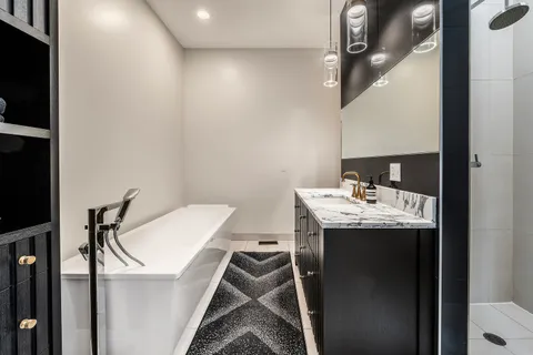 a bathroom with a sink and mirror