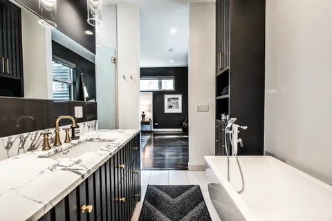 a kitchen with a sink and a refrigerator