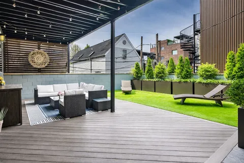 swimming pool view with a seating space