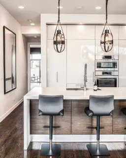 a room with table chairs and a chandelier