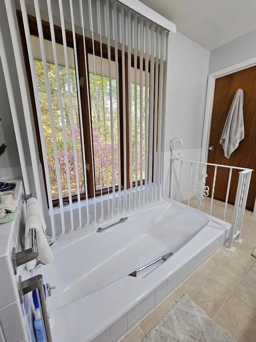 50 Valley Mill Road Swoope, VA 24479 - Photo 38 of 66 a bathroom with a bathtub and a window