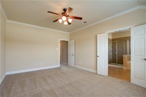 4679 Edith Street Plano, TX 75024 - Photo 23 of 34 Carpeted room featuring a ceiling fan with integrated lighting, crown molding, and baseboards