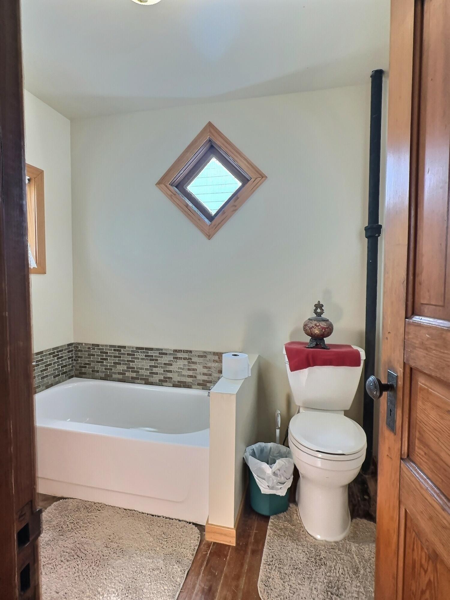 136 East Main Street Brook, IN 47922 - Photo 12 of 25 a bathroom with a toilet and a shower