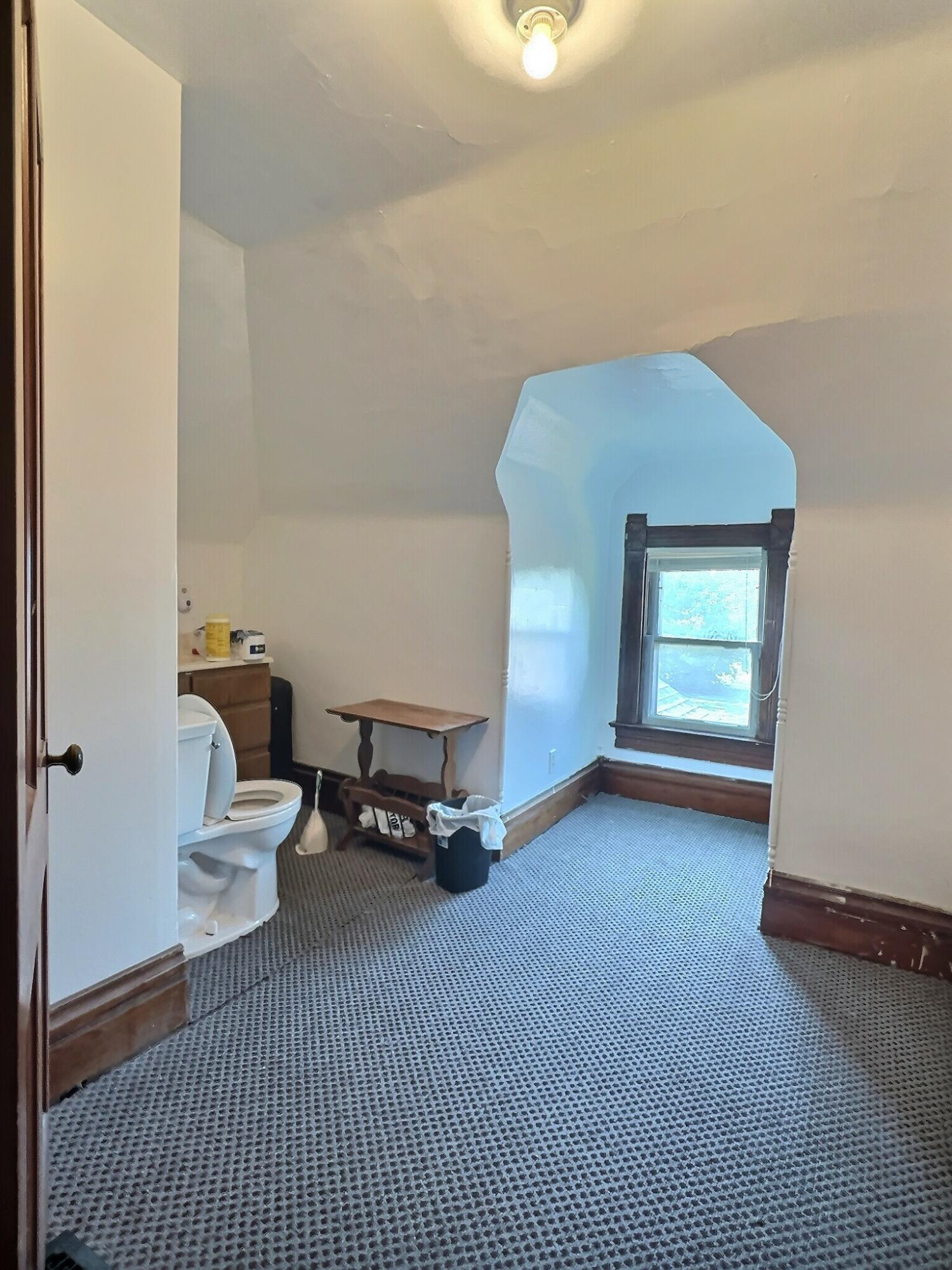 136 East Main Street Brook, IN 47922 - Photo 18 of 25 a room with a window