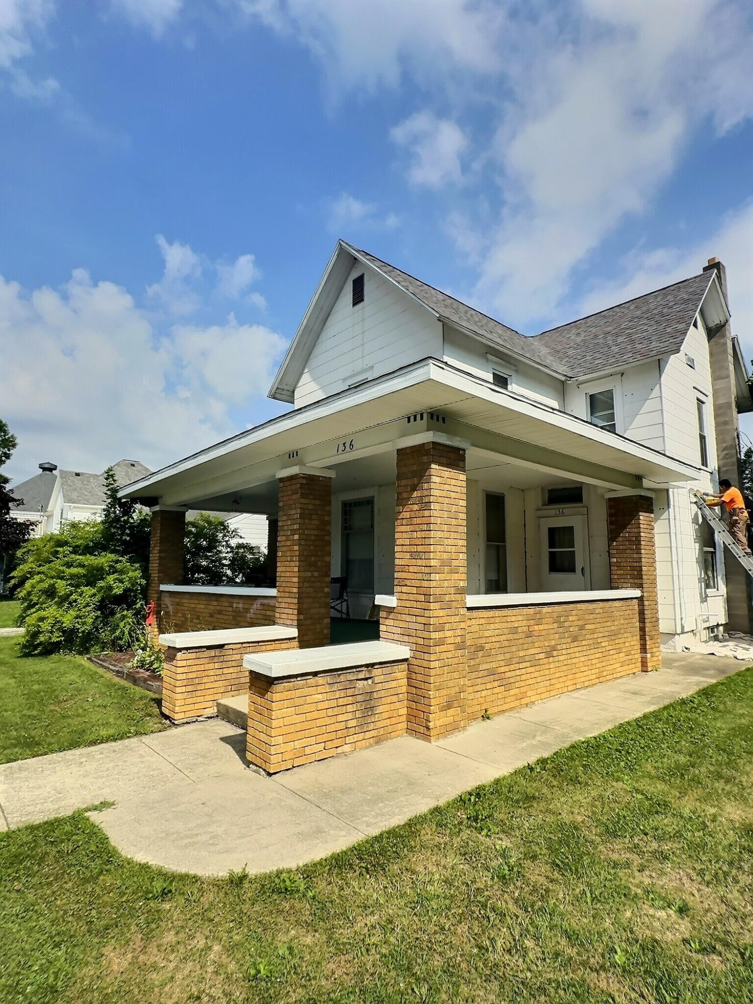 136 East Main Street Brook, IN 47922 - Photo 2 of 25 a view of house with yard