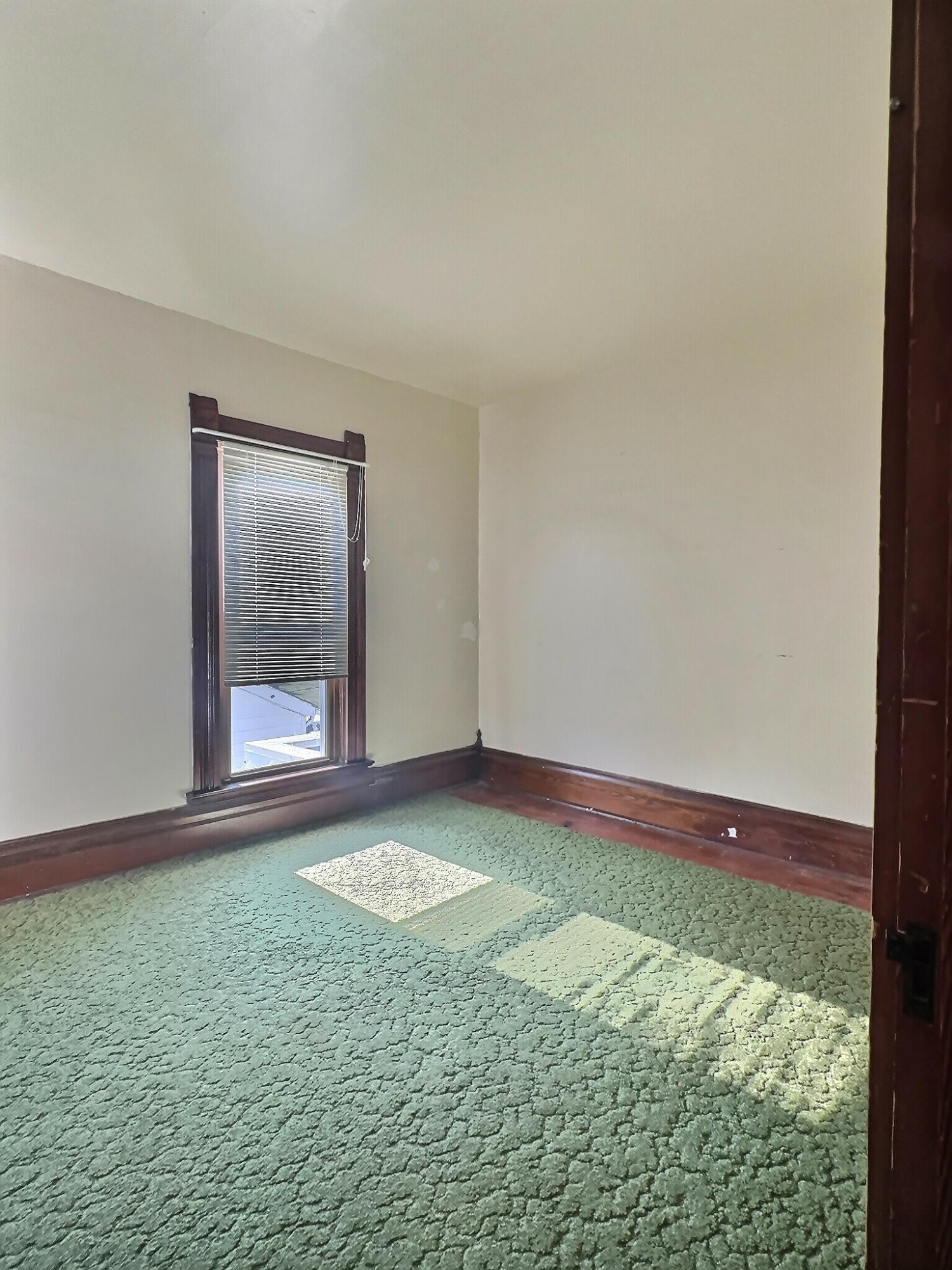 136 East Main Street Brook, IN 47922 - Photo 22 of 25 a view of an empty room and window