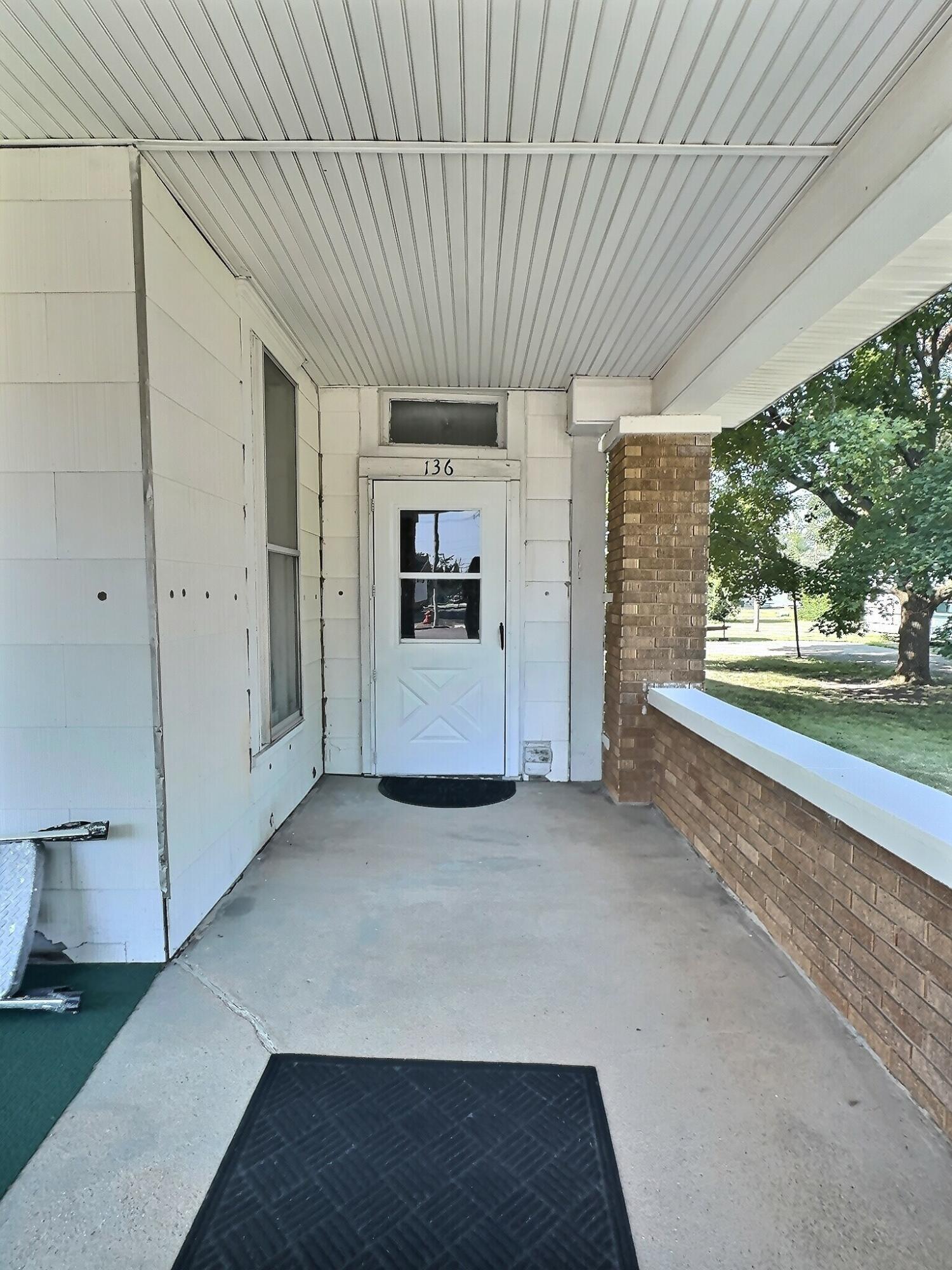 136 East Main Street Brook, IN 47922 - Photo 5 of 25 a view of a porch in front of house