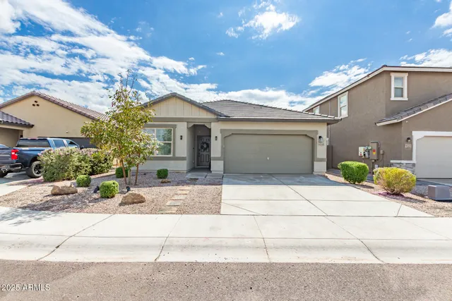 a view of house with yard