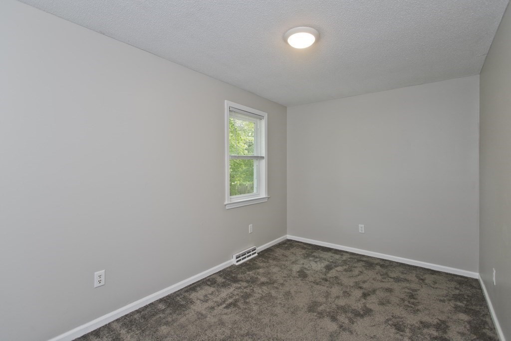 108 Odion Avenue Springfield, MA 01118 - Photo 15 of 24 an empty room with a window