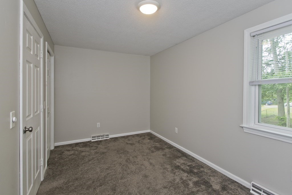 108 Odion Avenue Springfield, MA 01118 - Photo 16 of 24 an empty room with windows and closet