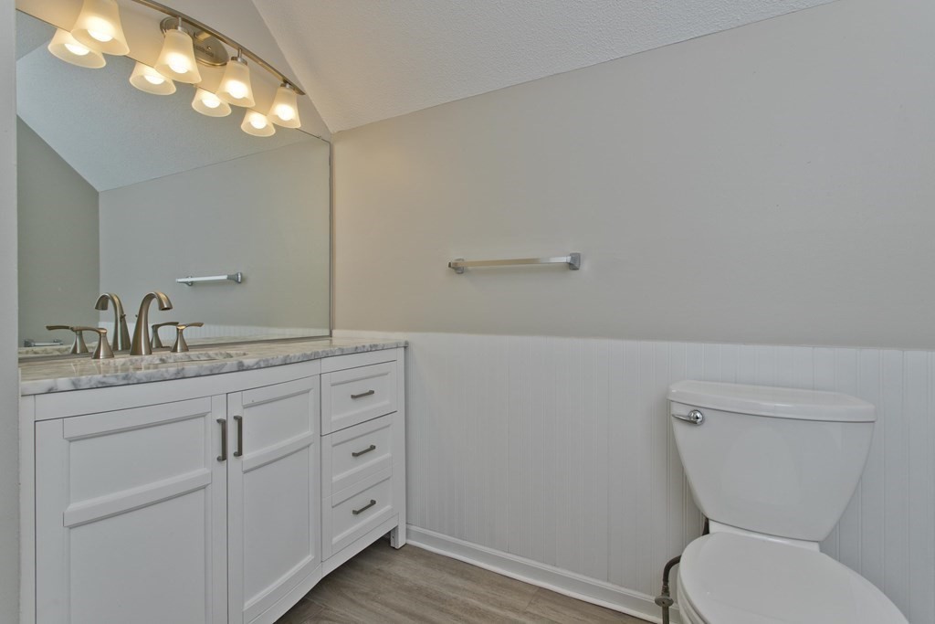 108 Odion Avenue Springfield, MA 01118 - Photo 17 of 24 a spacious bathroom with a toilet sink and mirror