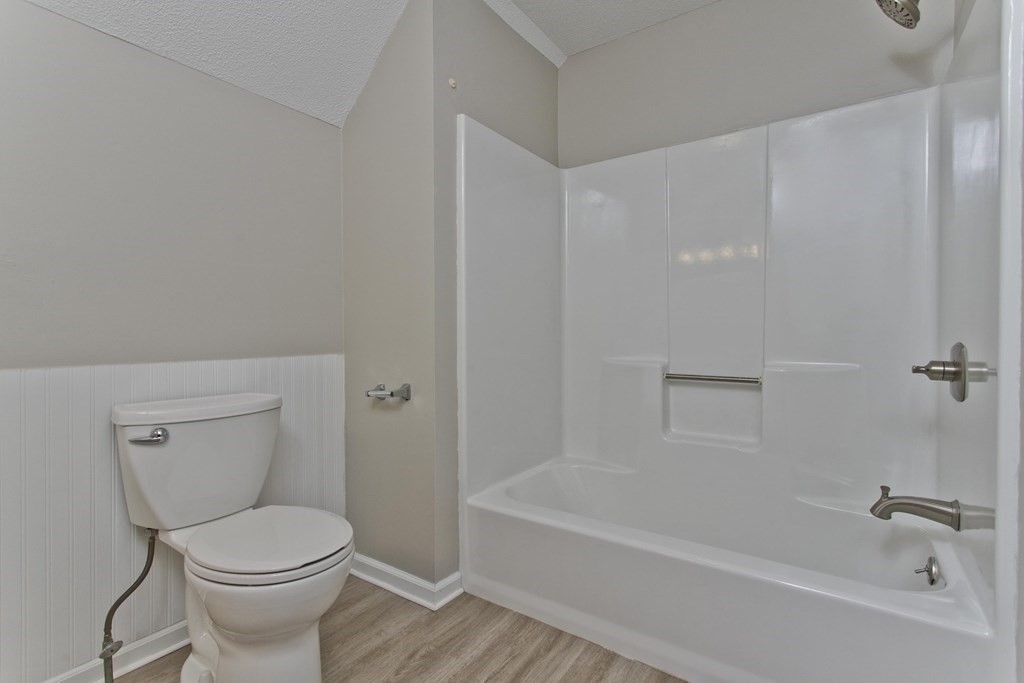 108 Odion Avenue Springfield, MA 01118 - Photo 18 of 24 a white toilet sitting next to a bath tub