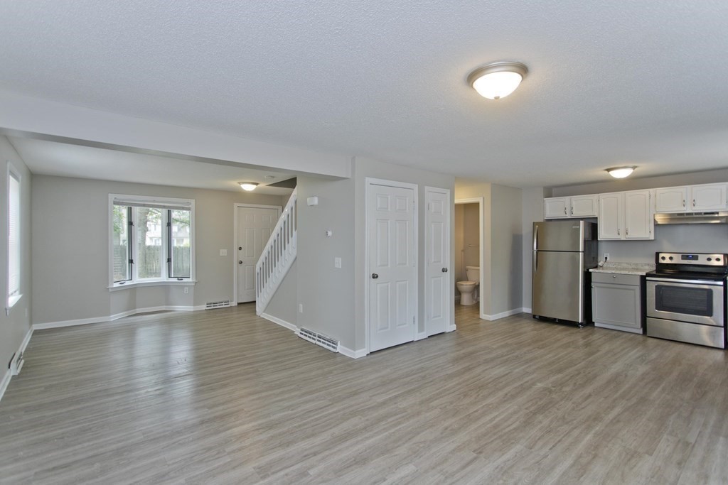 108 Odion Avenue Springfield, MA 01118 - Photo 7 of 24 a view of wooden floor and windows in an empty room