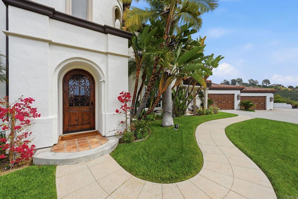 3244 Olivenhain Farms Road Encinitas, CA 92024 - Photo 4 of 47 a front view of a house with garden
