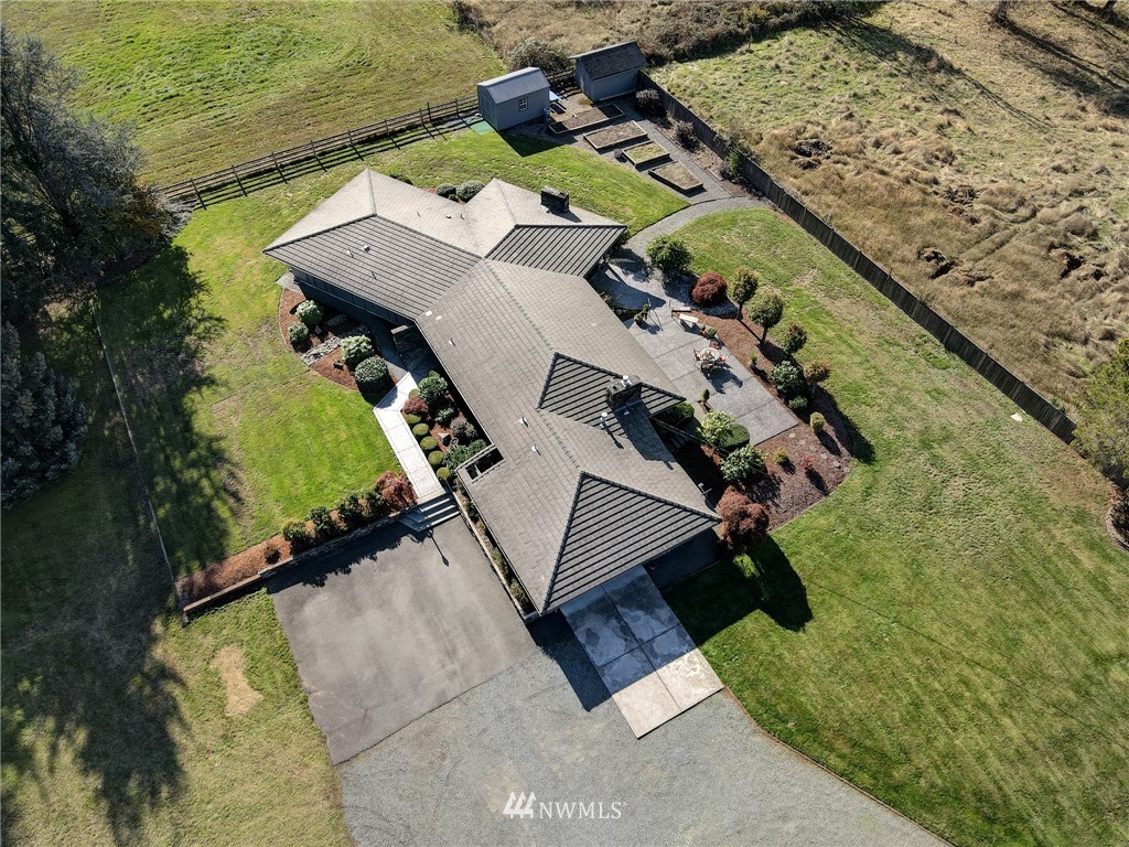 19415 Southeast 141st Street Renton, WA 98059 - Photo 1 of 39 an aerial view of a house with a ocean view