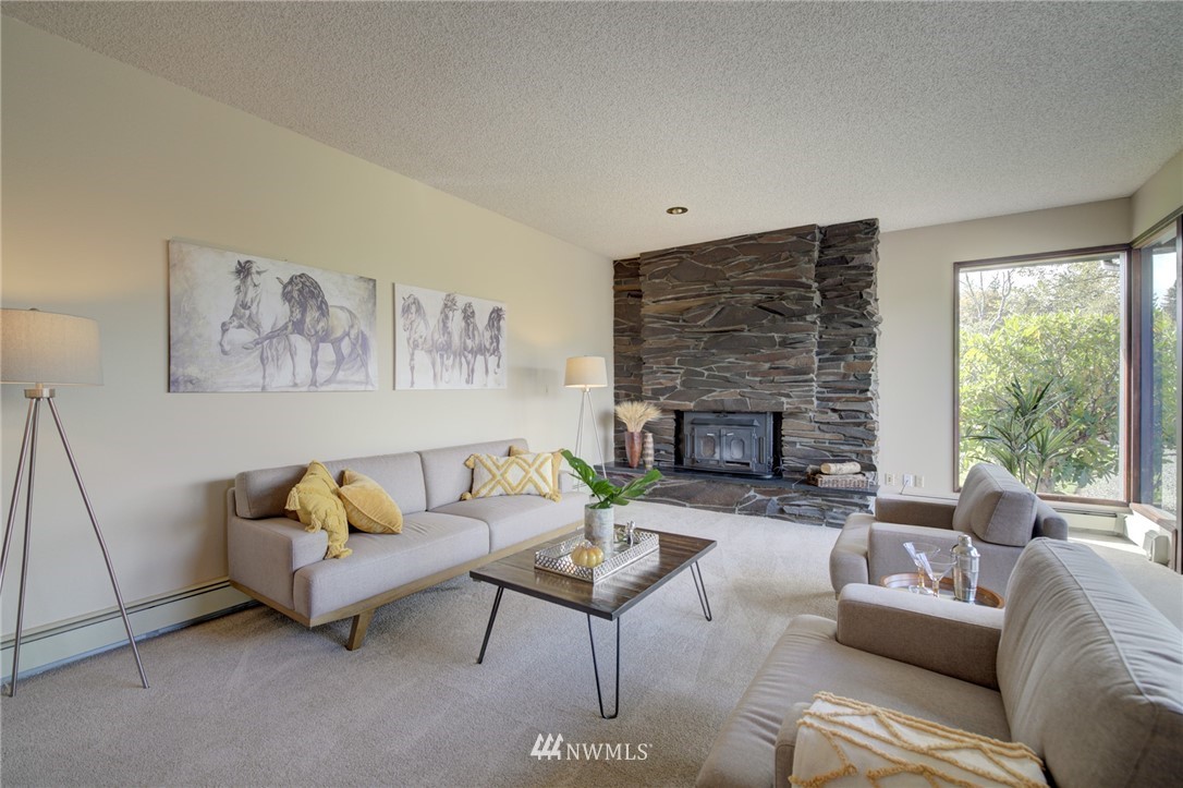 19415 Southeast 141st Street Renton, WA 98059 - Photo 11 of 39 a living room with furniture and a fireplace