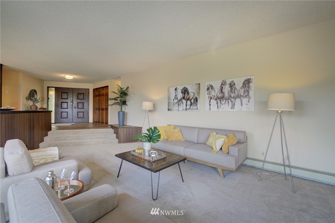 19415 Southeast 141st Street Renton, WA 98059 - Photo 12 of 39 a living room with furniture and a wooden floor