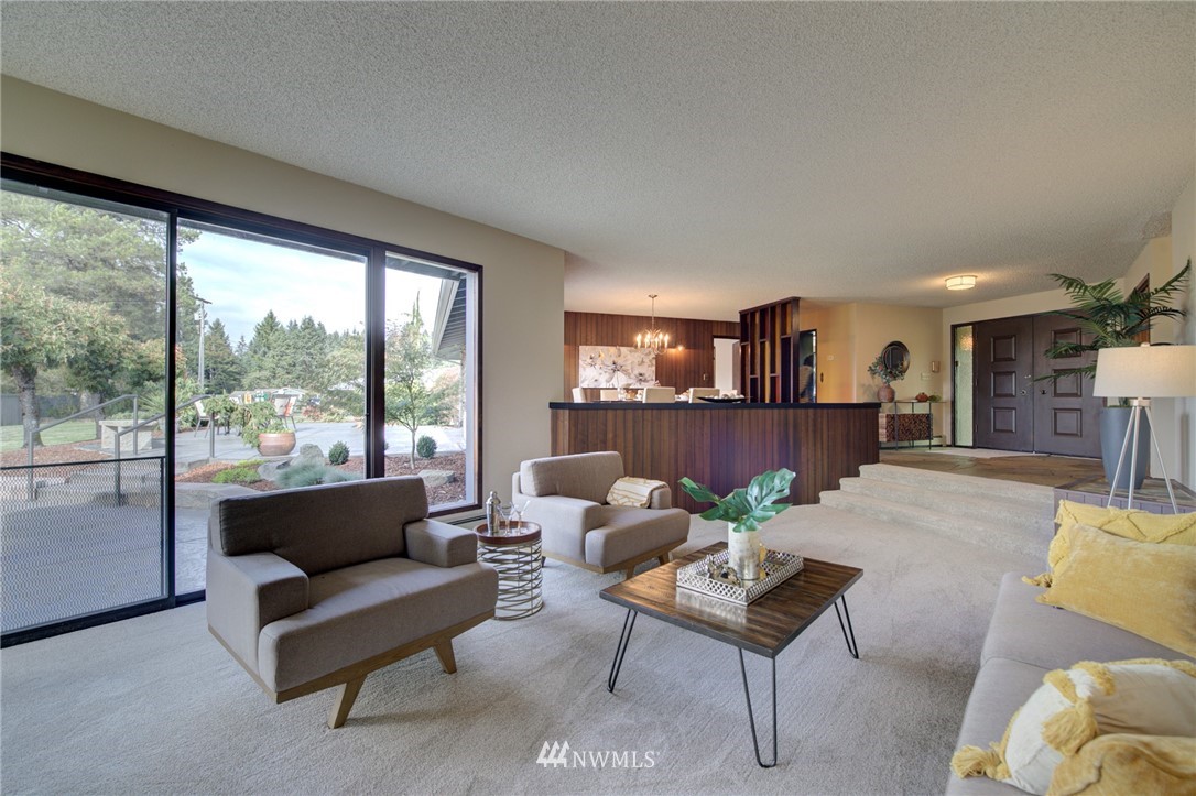 19415 Southeast 141st Street Renton, WA 98059 - Photo 13 of 39 a living room with furniture and a large window
