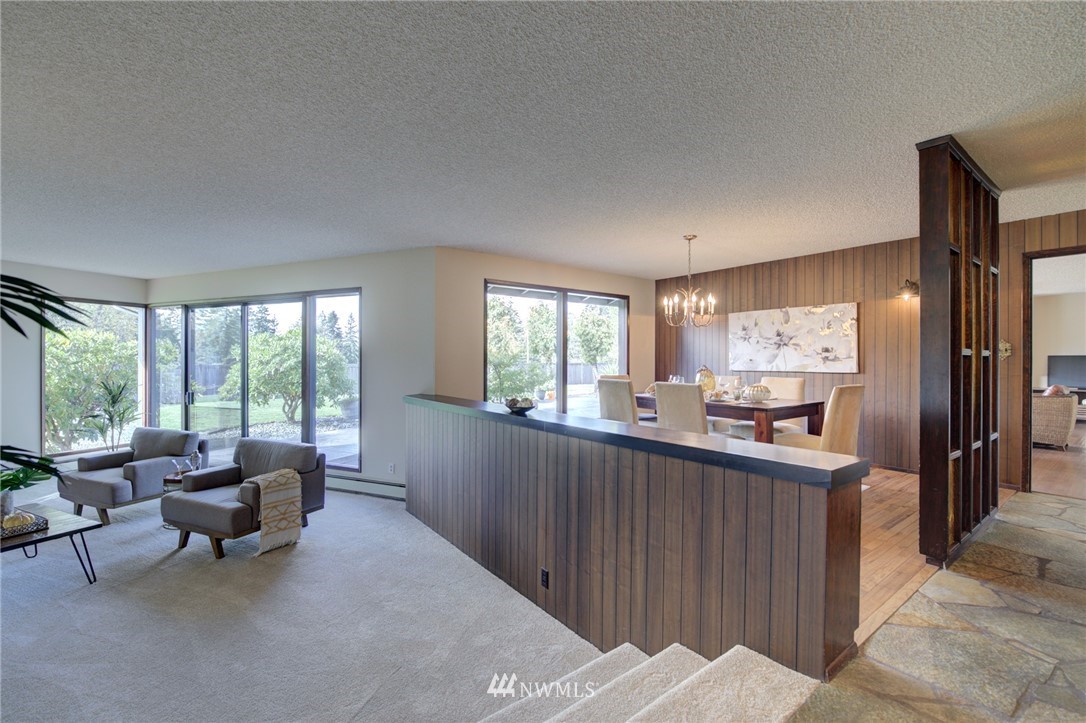 19415 Southeast 141st Street Renton, WA 98059 - Photo 14 of 39 a kitchen with granite countertop lots of counter top space and living room
