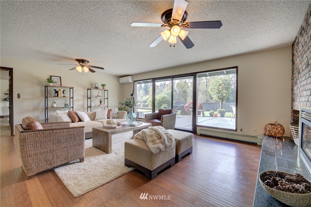19415 Southeast 141st Street Renton, WA 98059 - Photo 19 of 39 a living room with furniture and a large window