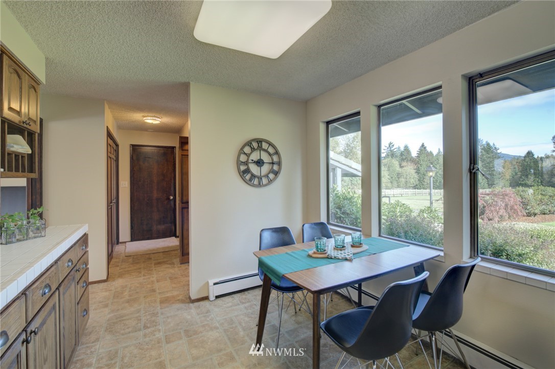 19415 Southeast 141st Street Renton, WA 98059 - Photo 24 of 39 a view of a dining room with furniture window and outside view