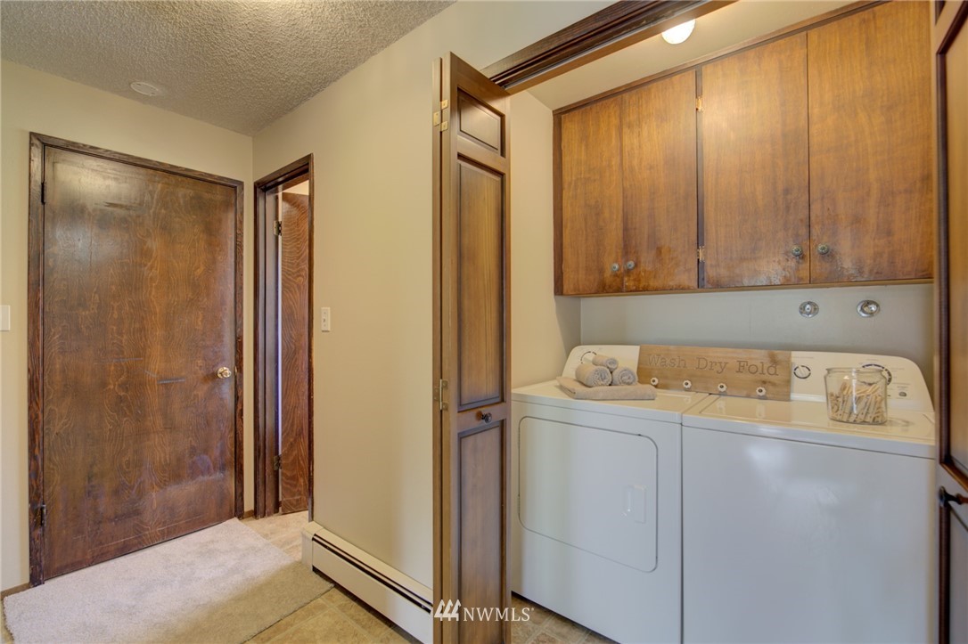 19415 Southeast 141st Street Renton, WA 98059 - Photo 27 of 39 a utility room with a washer and dryer