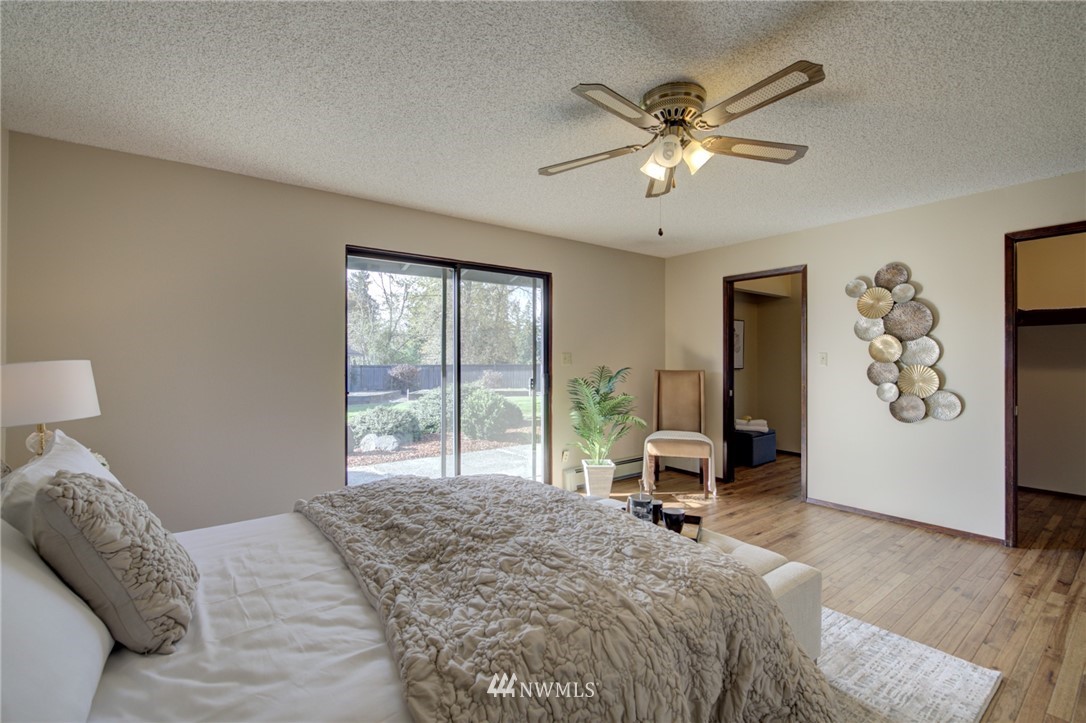 19415 Southeast 141st Street Renton, WA 98059 - Photo 29 of 39 a bedroom with a large bed and a window