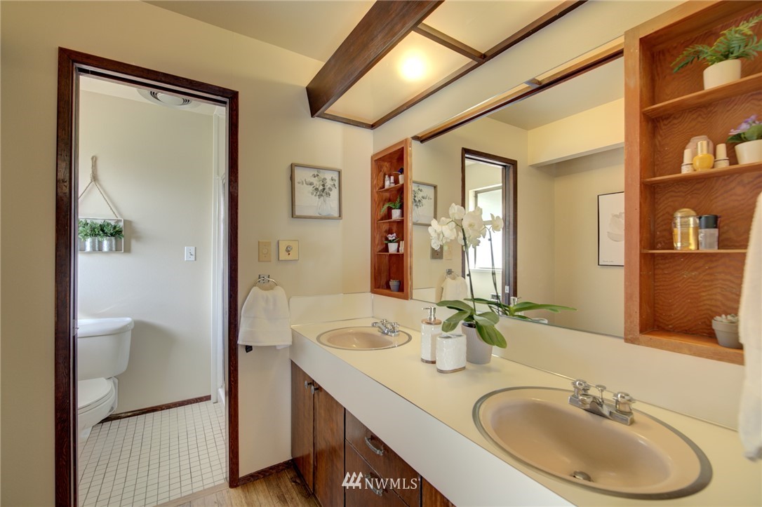 19415 Southeast 141st Street Renton, WA 98059 - Photo 30 of 39 a bathroom with a sink double vanity and a mirror