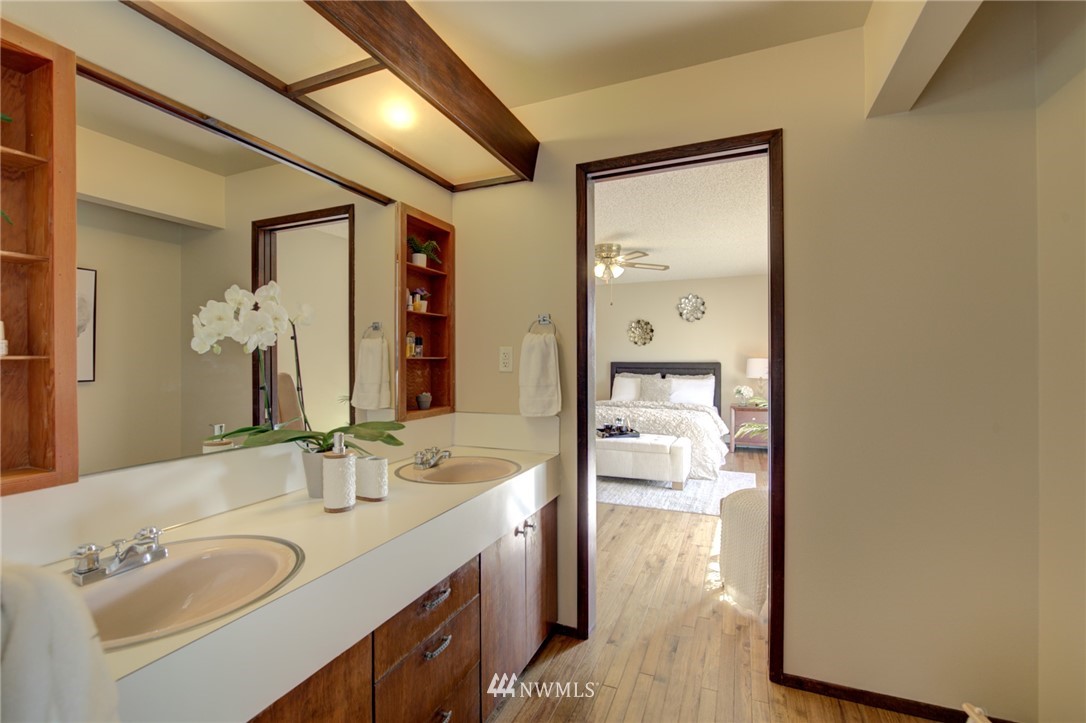 19415 Southeast 141st Street Renton, WA 98059 - Photo 31 of 39 a en suite bathroom with a granite countertop sink and a mirror