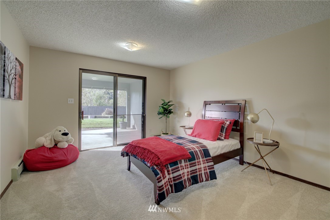 19415 Southeast 141st Street Renton, WA 98059 - Photo 33 of 39 a bedroom with a bed and a potted plant