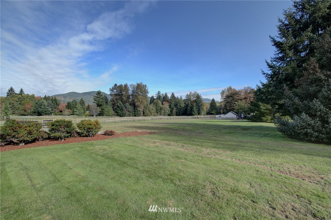 19415 Southeast 141st Street Renton, WA 98059 - Photo 38 of 39 a view of outdoor space with green field and trees