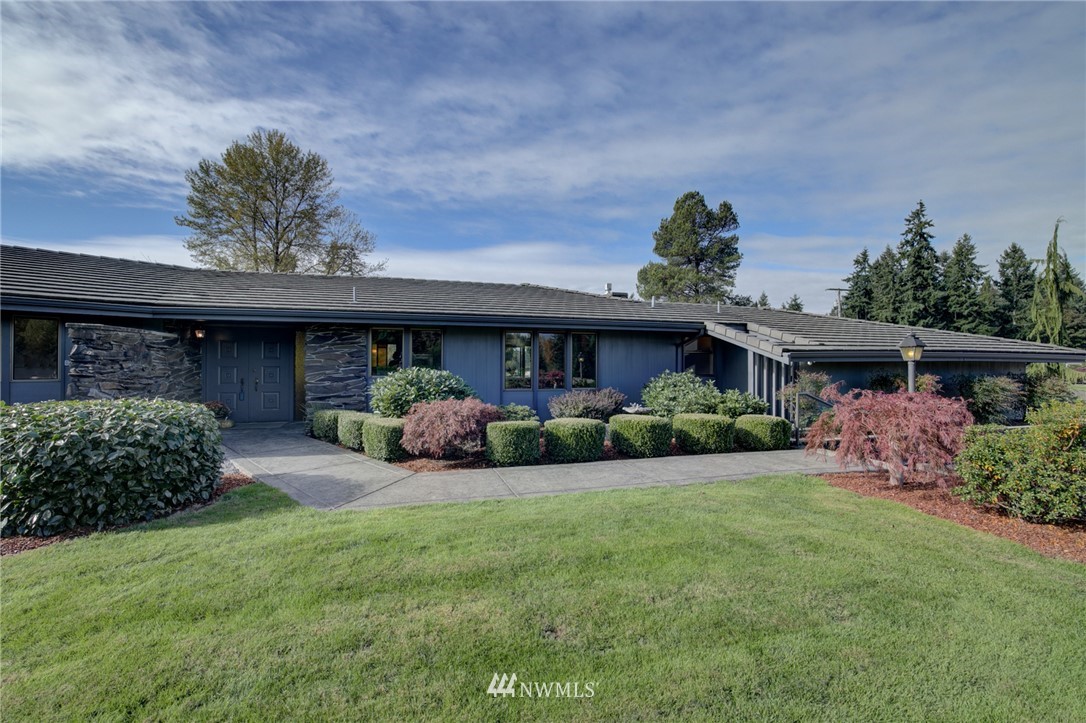 19415 Southeast 141st Street Renton, WA 98059 - Photo 5 of 39 a view of a house with a yard and plants