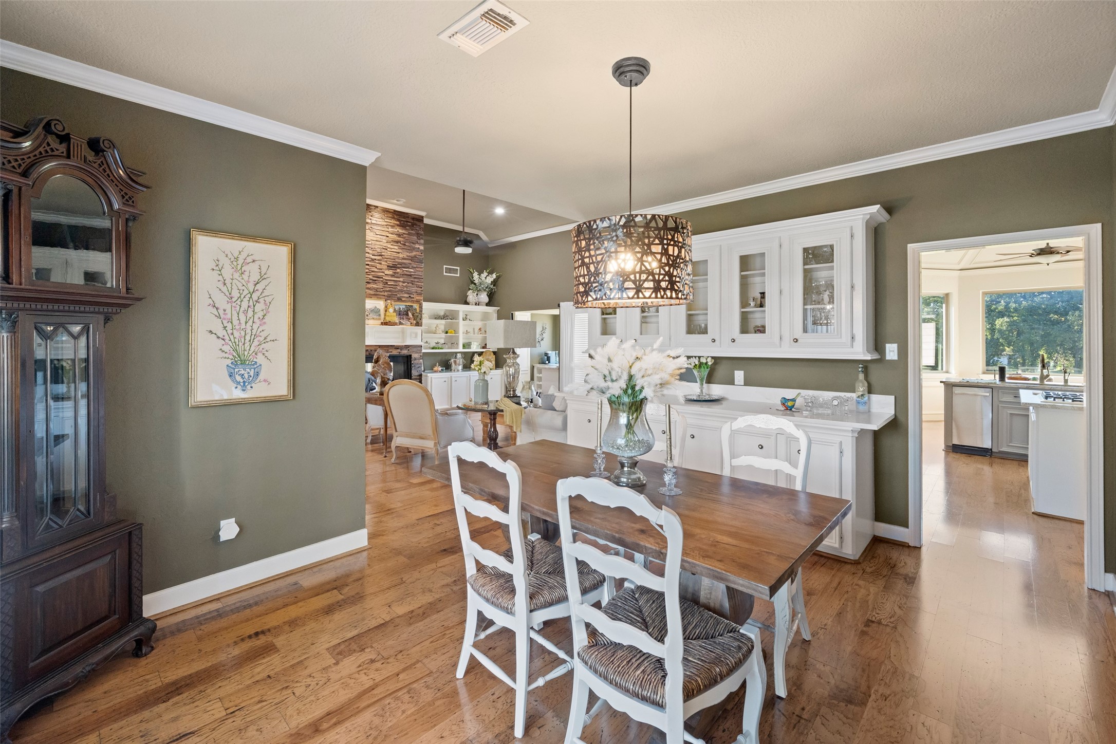 8314 Atascocita Lake Way Humble, TX 77346 - Photo 19 of 47 a view of a dining room with furniture wooden floor and chandelier