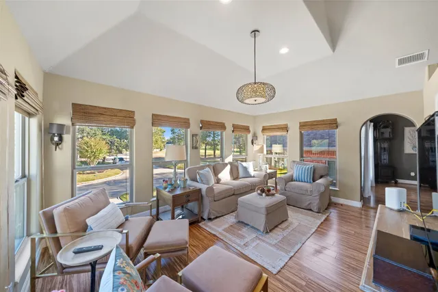 a kitchen with stainless steel appliances kitchen island granite countertop a stove a sink and a microwave