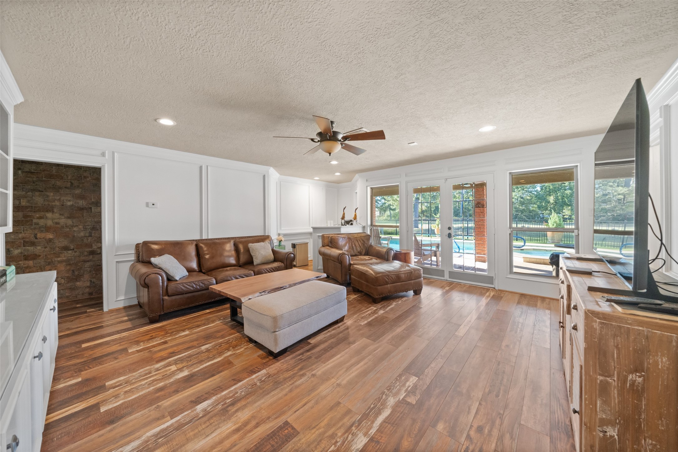 8314 Atascocita Lake Way Humble, TX 77346 - Photo 33 of 47 a living room with furniture and a large window