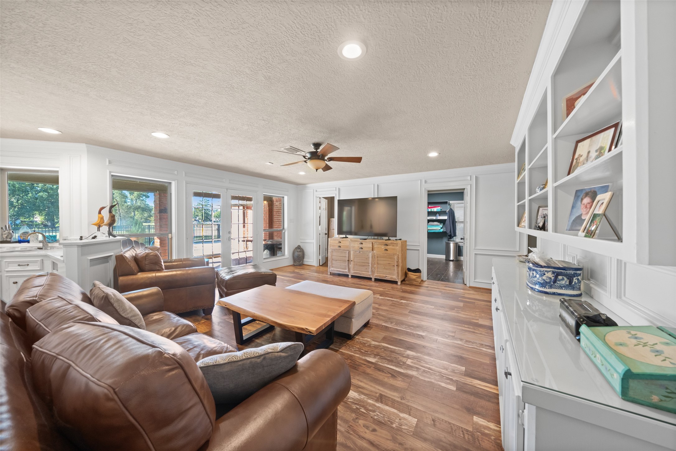 8314 Atascocita Lake Way Humble, TX 77346 - Photo 38 of 47 a living room with furniture and a flat screen tv