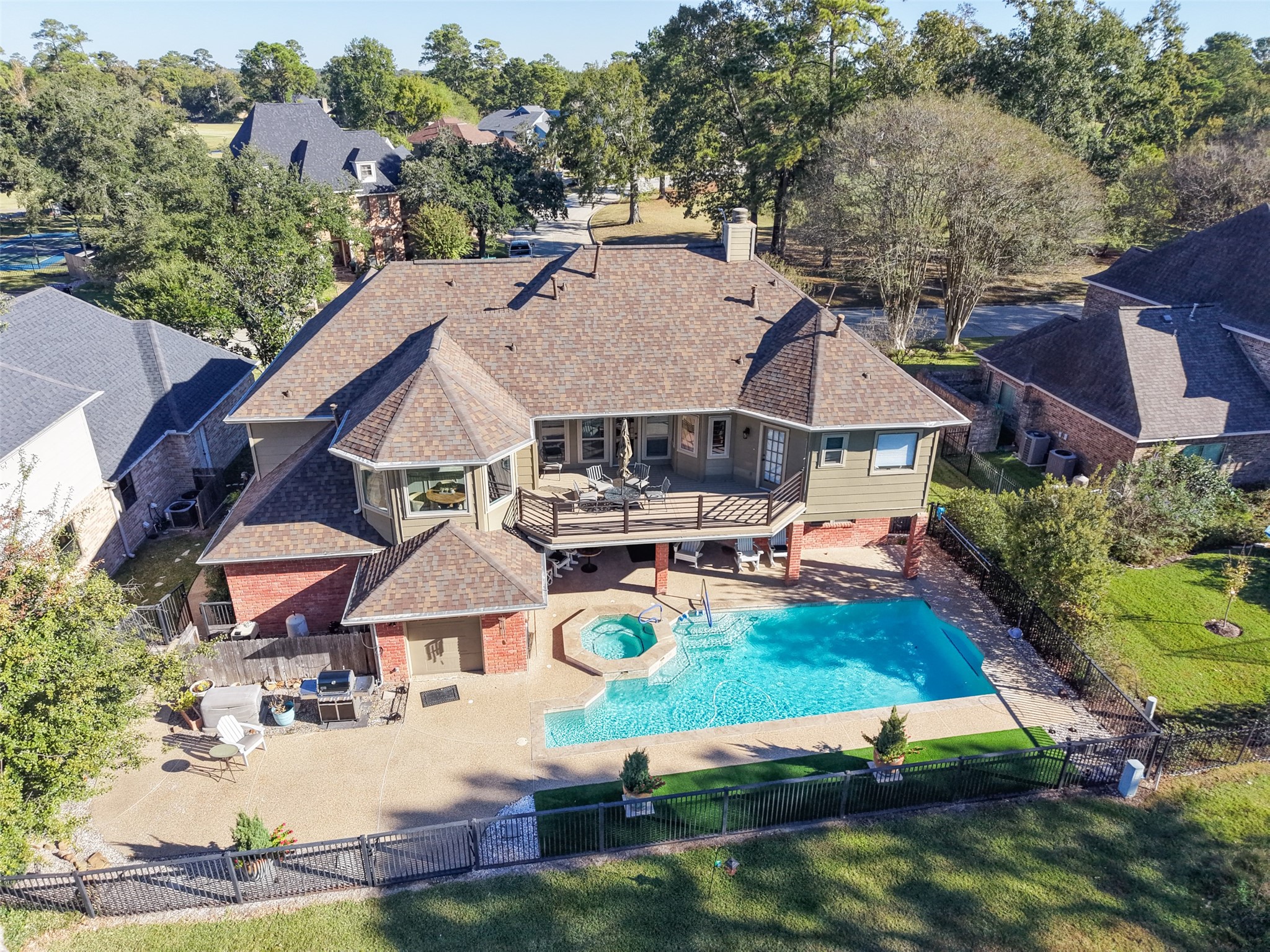 8314 Atascocita Lake Way Humble, TX 77346 - Photo 4 of 47 an aerial view of house with yard swimming pool and outdoor seating