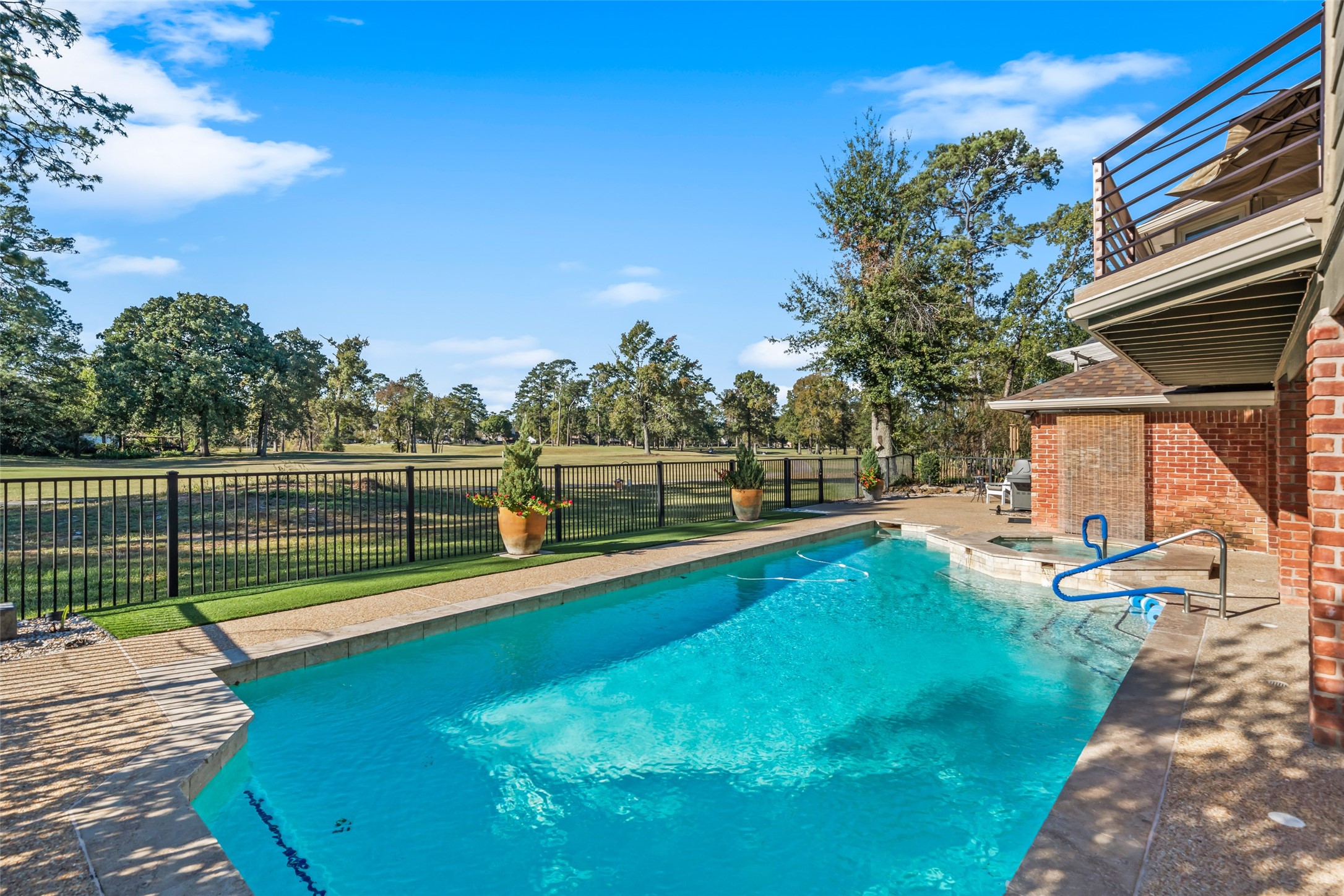 8314 Atascocita Lake Way Humble, TX 77346 - Photo 41 of 47 a view of a house with swimming pool and sitting area