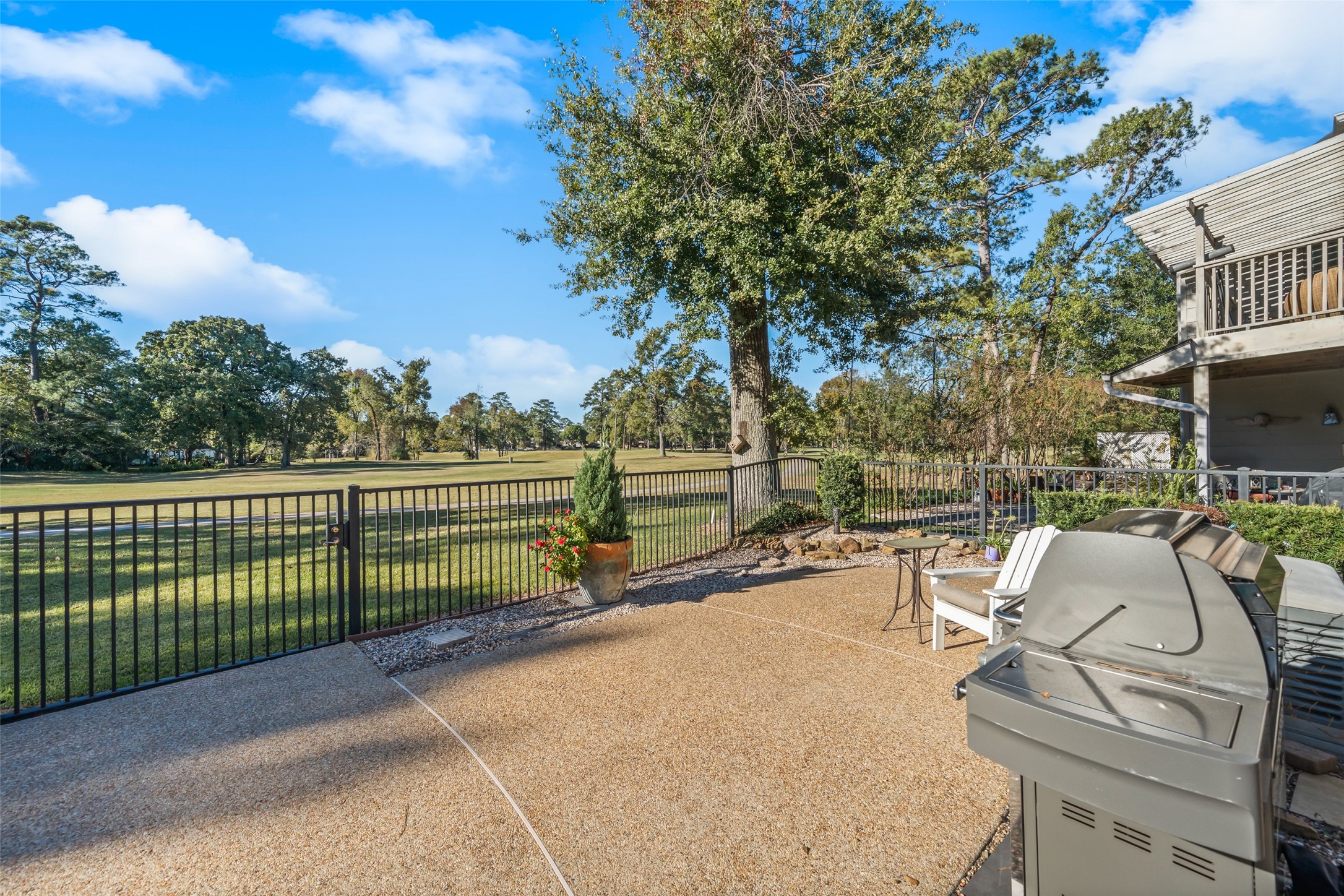 8314 Atascocita Lake Way Humble, TX 77346 - Photo 6 of 47 a view of a patio with a table chairs and a fire pit