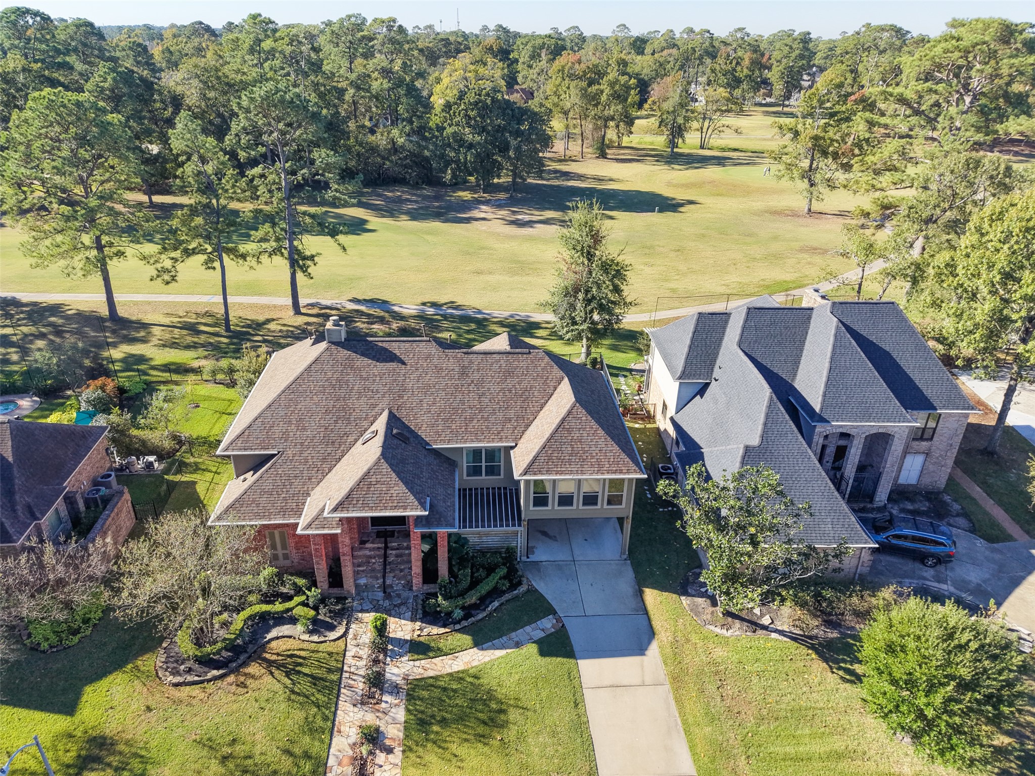 8314 Atascocita Lake Way Humble, TX 77346 - Photo 8 of 47 an aerial view of residential houses with outdoor space and ocean view