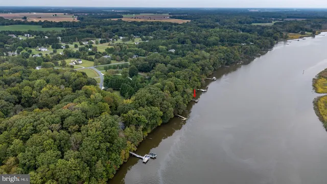 an aerial view of a house with a lake view