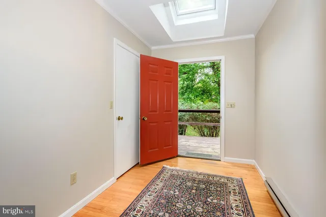 a living room with furniture rug and a large window