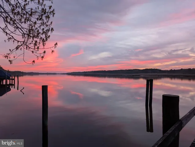 a view of balcony with furniture and a fire pit